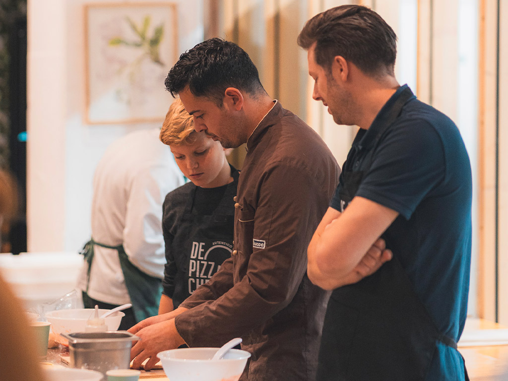 Deelnemers aan de pizzaworkshop